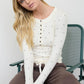 POLKA DOT LONG SLEEVE HENLEY KNIT TOP
