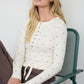 POLKA DOT LONG SLEEVE HENLEY KNIT TOP