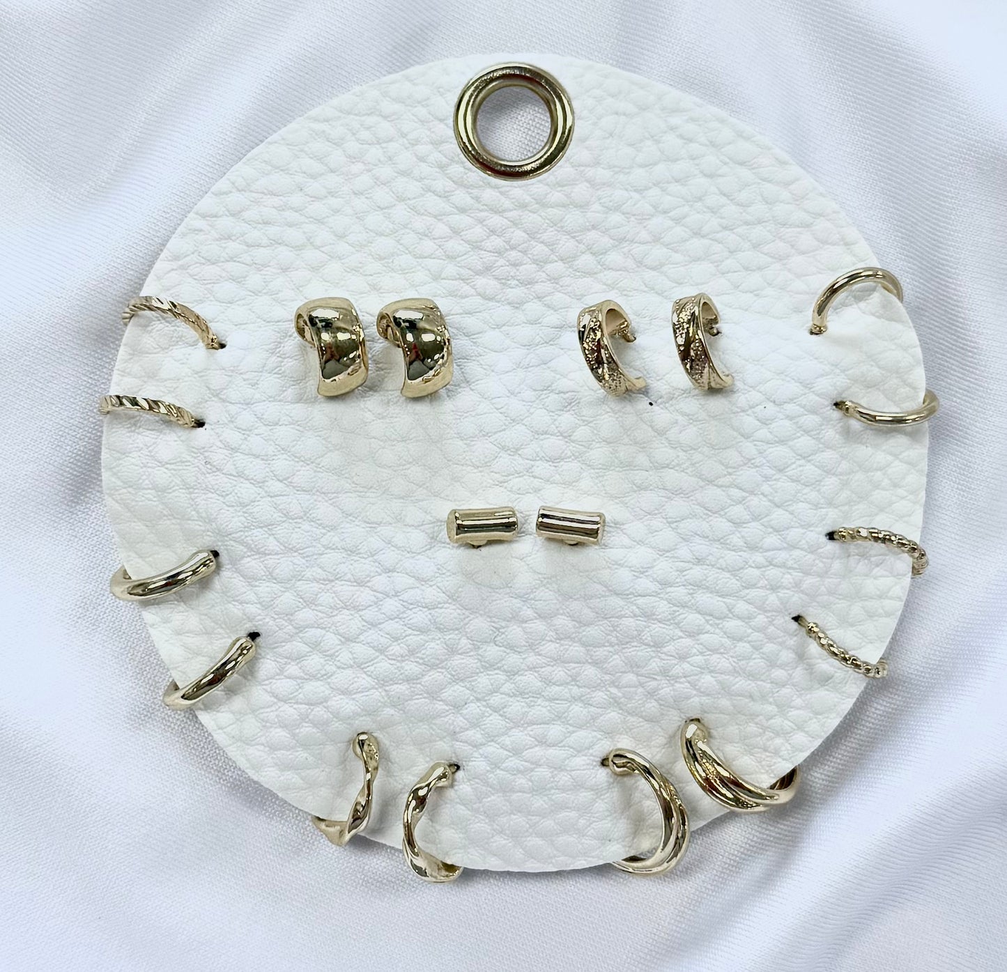 Set of 9 Geometric Stud and Hoop Sets on a Leather Circle Display, Best Seller!