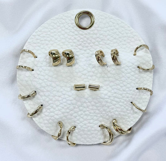 Set of 9 Geometric Stud and Hoop Sets on a Leather Circle Display, Best Seller!