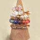 LAYERED MULTI BEADED FLORAL BOW STACKABLE RING SET | 80R053