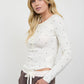 POLKA DOT LONG SLEEVE HENLEY KNIT TOP