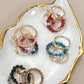 LAYERED MULTI BEADED FLORAL BOW STACKABLE RING SET | 80R053