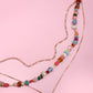 MULTI LAYERED BEADED HEART CHARM NECKLACE